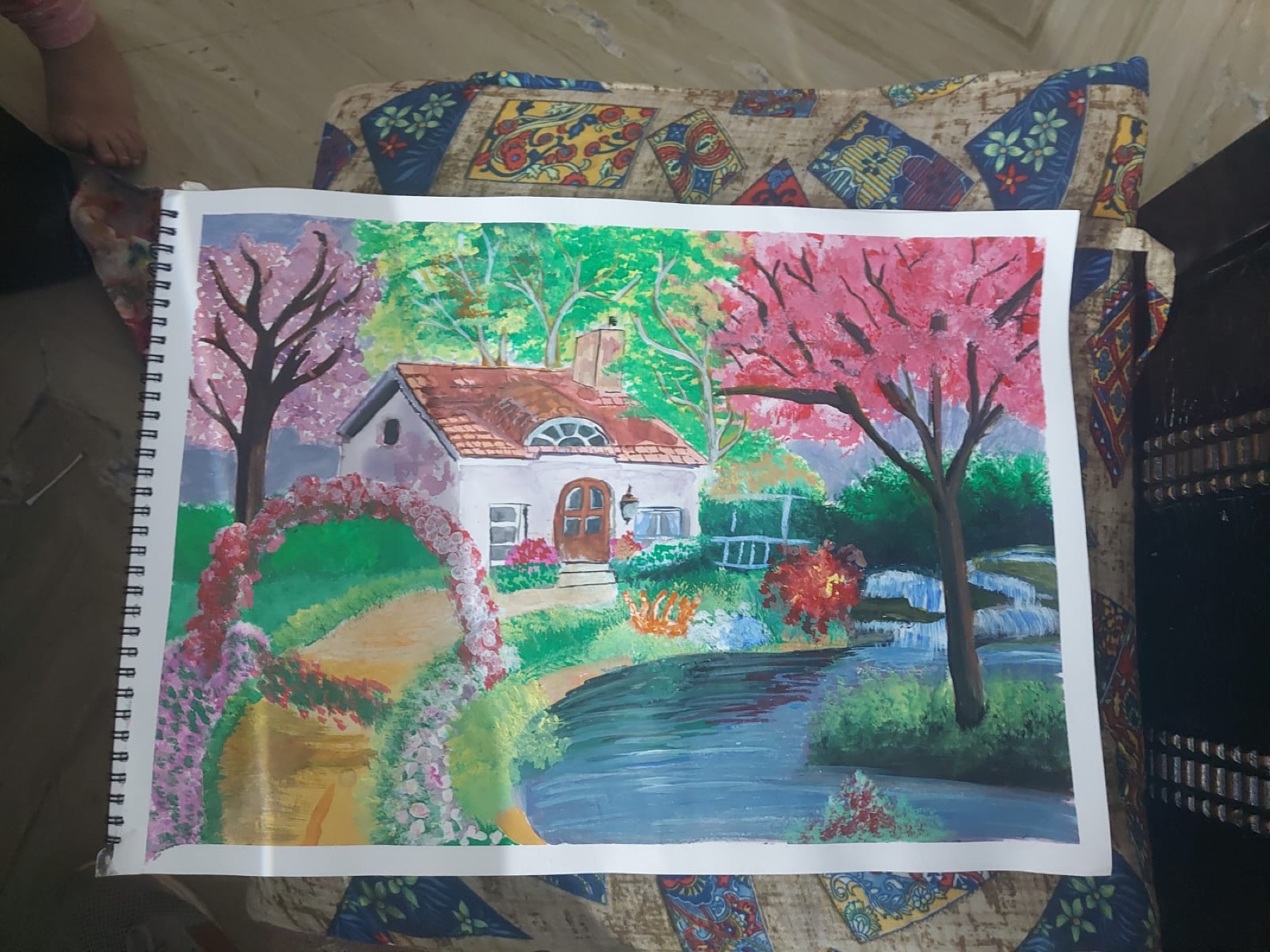 Colorful landscape artwork made by a Nino learner