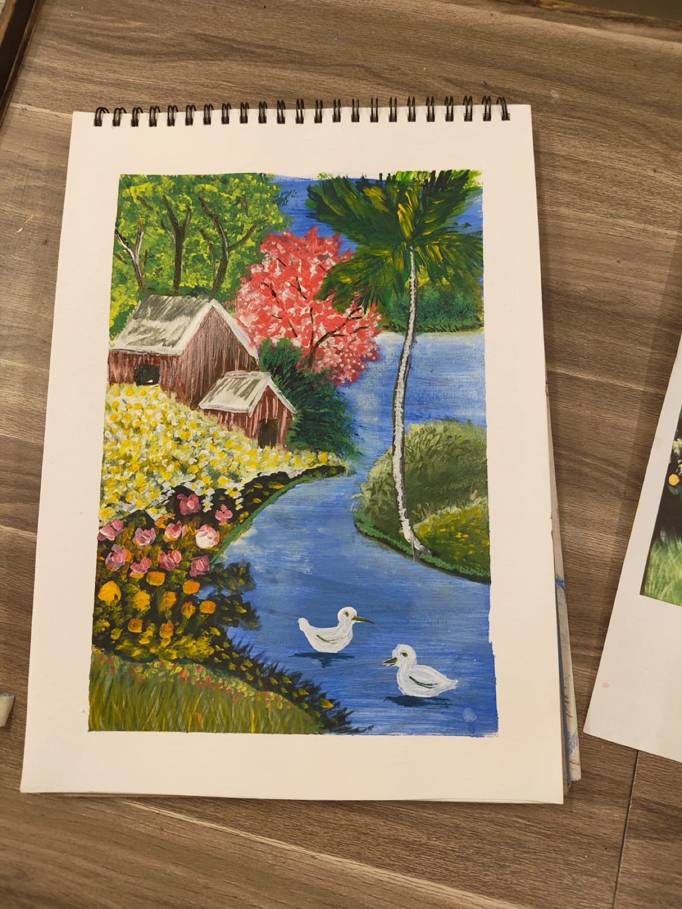 Riverside landscape artwork made by a Nino learner